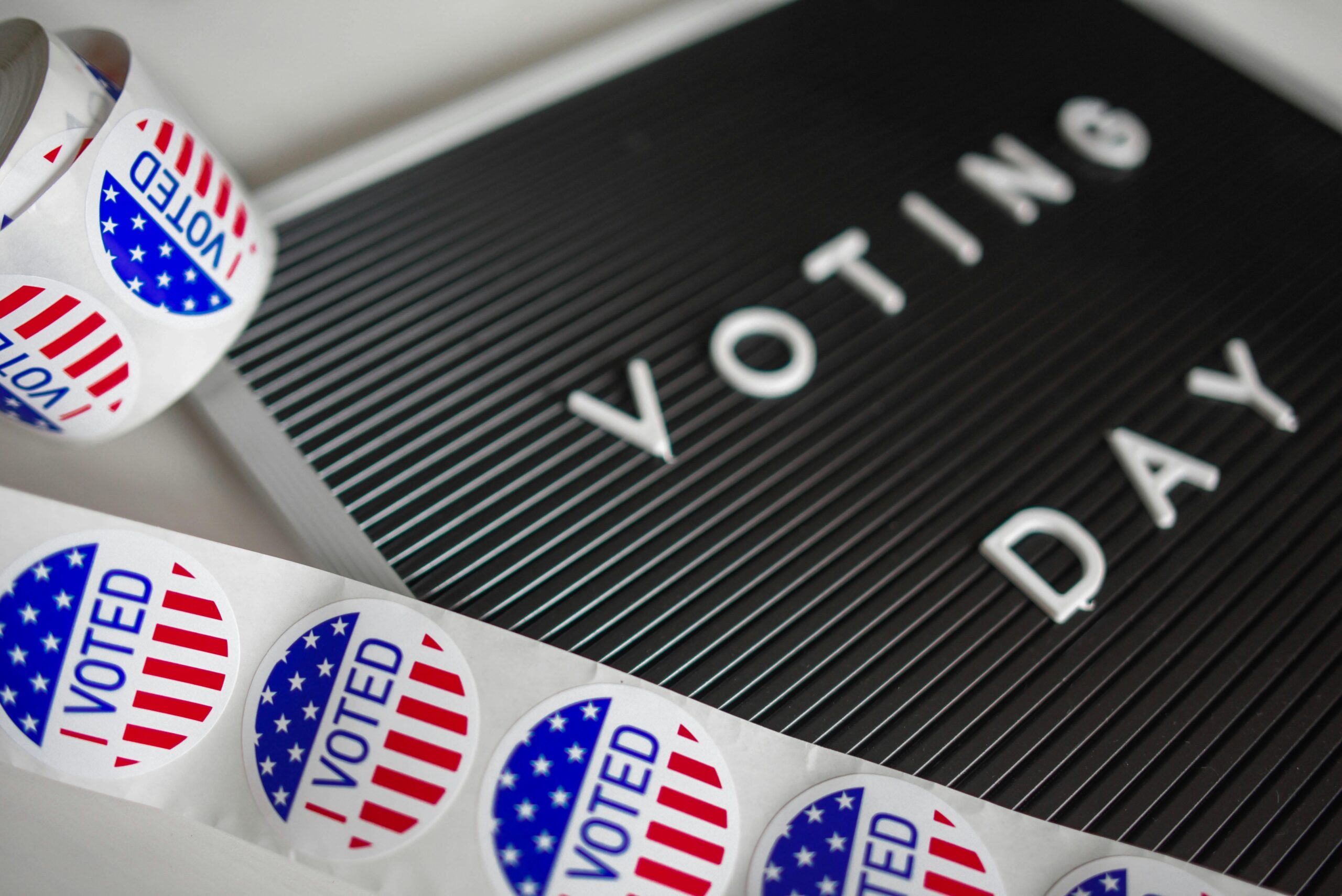 Bexar Bones Newsletter Photo of I Voted Stickers. Voting Day with a ribbon of I Voted stickers.