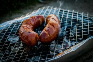 Brats on a grill.